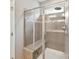 Tiled shower stall features a built-in bench and a glass enclosure for a spa-like experience at 200 Sweet Briar Dr, Fort Mill, SC 29707