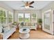 Bright sun room with multiple windows, comfortable seating, and natural light at 200 Sweet Briar Dr, Fort Mill, SC 29707