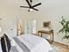Spacious bedroom with ensuite bathroom, featuring a desk and a large window at 2017 Brewton Dr, Charlotte, NC 28206