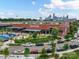 Exterior shot of Tipsey Pickle at Camp North End with Uptown Charlotte in the distance at 2017 Brewton Dr, Charlotte, NC 28206