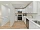 Modern kitchen featuring stainless steel appliances, white cabinets and countertops at 2017 Brewton Dr, Charlotte, NC 28206