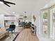 An open floor plan showing a kitchen with stainless steel appliances and a dining area with seating for four at 2017 Brewton Dr, Charlotte, NC 28206