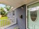 Welcoming porch entrance with storm door and painted gray brick at 2017 Brewton Dr, Charlotte, NC 28206