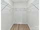 Spacious walk-in closet providing ample storage with functional wire shelving at 2017 Brewton Dr, Charlotte, NC 28206