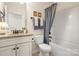 Bathroom featuring a granite vanity, toilet, and tub with shower at 2066 Vermount Way, Indian Land, SC 29707