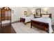 Bedroom with two beds, wood floors, and decorative cabinet at 2066 Vermount Way, Indian Land, SC 29707