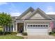 Charming home featuring neutral siding, an attached two car garage, manicured landscaping, and welcoming entryway at 2066 Vermount Way, Indian Land, SC 29707