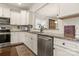 Bright kitchen with stainless steel appliances, granite counters, white cabinets, and subway tile backsplash at 2066 Vermount Way, Indian Land, SC 29707