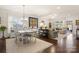 Open concept living space featuring wood floors, neutral decor, and a view into the dining room at 2066 Vermount Way, Indian Land, SC 29707