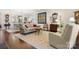Open concept living space featuring wood floors, neutral decor, and a view into the dining room and kitchen at 2066 Vermount Way, Indian Land, SC 29707