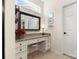 Bathroom vanity area with granite counters, stool, mirror and natural lighting at 2066 Vermount Way, Indian Land, SC 29707