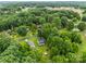 Aerial view of the property nestled among lush trees, showcasing the home's location at 2146 Marwood Ln, Albemarle, NC 28001