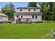 Spacious backyard with a wooden deck, well-kept lawn, and plenty of room for outdoor activities and relaxation at 2146 Marwood Ln, Albemarle, NC 28001
