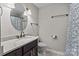 Bathroom featuring updated vanity, granite countertops, and a shower-tub combo at 2146 Marwood Ln, Albemarle, NC 28001