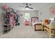 Spacious bedroom includes a comfortable bed, ceiling fan, and ample closet space for storage and organization at 2146 Marwood Ln, Albemarle, NC 28001