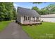 Charming home featuring a well-kept lawn, a driveway with basketball hoop, and a cozy front porch at 2146 Marwood Ln, Albemarle, NC 28001