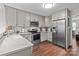 Modern kitchen equipped with stainless steel appliances, marble countertops, and wooden floors at 2146 Marwood Ln, Albemarle, NC 28001