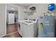 Convenient laundry room with modern washer and dryer units and ample storage space at 2146 Marwood Ln, Albemarle, NC 28001