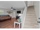 Bright living room with wood flooring, a staircase, and neutral walls at 2146 Marwood Ln, Albemarle, NC 28001