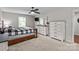 Well-lit main bedroom with a mounted TV and abundant dresser storage at 2146 Marwood Ln, Albemarle, NC 28001