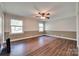 Bright bedroom with neutral walls, ceiling fan and hardwood floors, offering a serene space at 257 Amity Dr, York, SC 29745