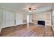 Bedroom with a ceiling fan and multiple closets, complemented by wood floors at 257 Amity Dr, York, SC 29745