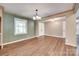 Classic dining area featuring wood floors, modern chandelier, and open space at 257 Amity Dr, York, SC 29745