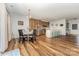 Bright dining area with wood floors next to kitchen island with stainless steel appliances at 2705 Enon Church Rd, Salisbury, NC 28147