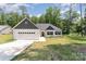Charming single-story home with white siding, a two-car garage, and a well-maintained lawn at 2705 Enon Church Rd, Salisbury, NC 28147