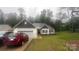 Charming single-story home with a white exterior, a dark shingled roof and an attached two-car garage at 2705 Enon Church Rd, Salisbury, NC 28147