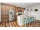 Modern kitchen with stainless steel appliances, granite countertops, an island with seating and wood floors at 2705 Enon Church Rd, Salisbury, NC 28147