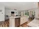 Bright kitchen with granite countertops and stainless steel appliances opens to the living and dining area at 2705 Enon Church Rd, Salisbury, NC 28147