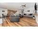 Spacious living room with an open floor plan, wood floors, and modern furnishings with easy access to the kitchen at 2705 Enon Church Rd, Salisbury, NC 28147