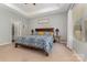 Bright main bedroom featuring tray ceilings, large bed, and ample natural light at 2705 Enon Church Rd, Salisbury, NC 28147