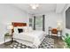 Cozy bedroom with a work station, neutral colors, and decorative rugs at 300 W 5Th St # 003, Charlotte, NC 28202
