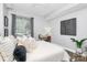 Bedroom featuring a large window, workstation, and neutral decor at 300 W 5Th St # 003, Charlotte, NC 28202