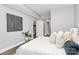 Bedroom with gray walls, wood floors and decor, and view of another room at 300 W 5Th St # 003, Charlotte, NC 28202