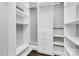 Spacious walk-in closet with custom shelving and drawers at 300 W 5Th St # 003, Charlotte, NC 28202