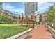 An outdoor sitting area with trellised entryway and manicured hedges at 300 W 5Th St # 003, Charlotte, NC 28202
