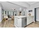 Spacious kitchen featuring bar seating, stainless steel appliances, and an open concept at 300 W 5Th St # 003, Charlotte, NC 28202