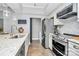 Modern kitchen featuring stainless steel appliances and a stylish backsplash at 300 W 5Th St # 003, Charlotte, NC 28202