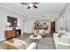Bright living room flows into the kitchen, featuring hardwood floors and modern decor at 300 W 5Th St # 003, Charlotte, NC 28202