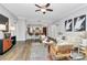Bright living room flows into the kitchen, featuring hardwood floors and modern decor at 300 W 5Th St # 003, Charlotte, NC 28202
