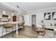 Bright living room featuring hardwood floors, bar seating, and a neutral color palette at 300 W 5Th St # 003, Charlotte, NC 28202