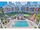A landscaped pool area featuring lounge chairs, greenery, and a gazebo at 300 W 5Th St # 003, Charlotte, NC 28202