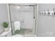 Nicely tiled shower with glass door and modern showerhead at 300 W 5Th St # 003, Charlotte, NC 28202