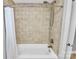 Bathroom featuring neutral tile in shower/tub combination with white shower curtain at 300 W 5Th St # 003, Charlotte, NC 28202