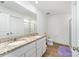 Bathroom with double vanity, granite countertops, a toilet, and a shower at 3077 Light Ridge Sw Ct, Concord, NC 28027