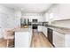 This modern kitchen is fitted with stainless steel appliances and granite countertops at 3077 Light Ridge Sw Ct, Concord, NC 28027