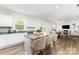The kitchen features an island with barstool seating, granite countertops, and stainless steel appliances at 3077 Light Ridge Sw Ct, Concord, NC 28027